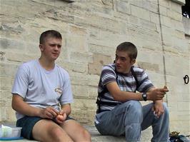 Gavin and Luke finish their lunch by the River Seine in Paris, near Pont des Arts
